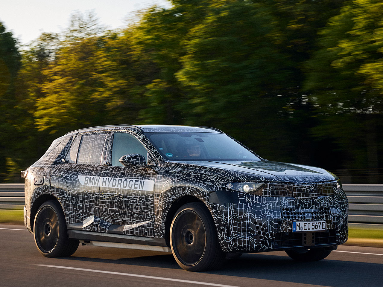 A camouflaged BMW iX5 Hydrogen on the test  track.