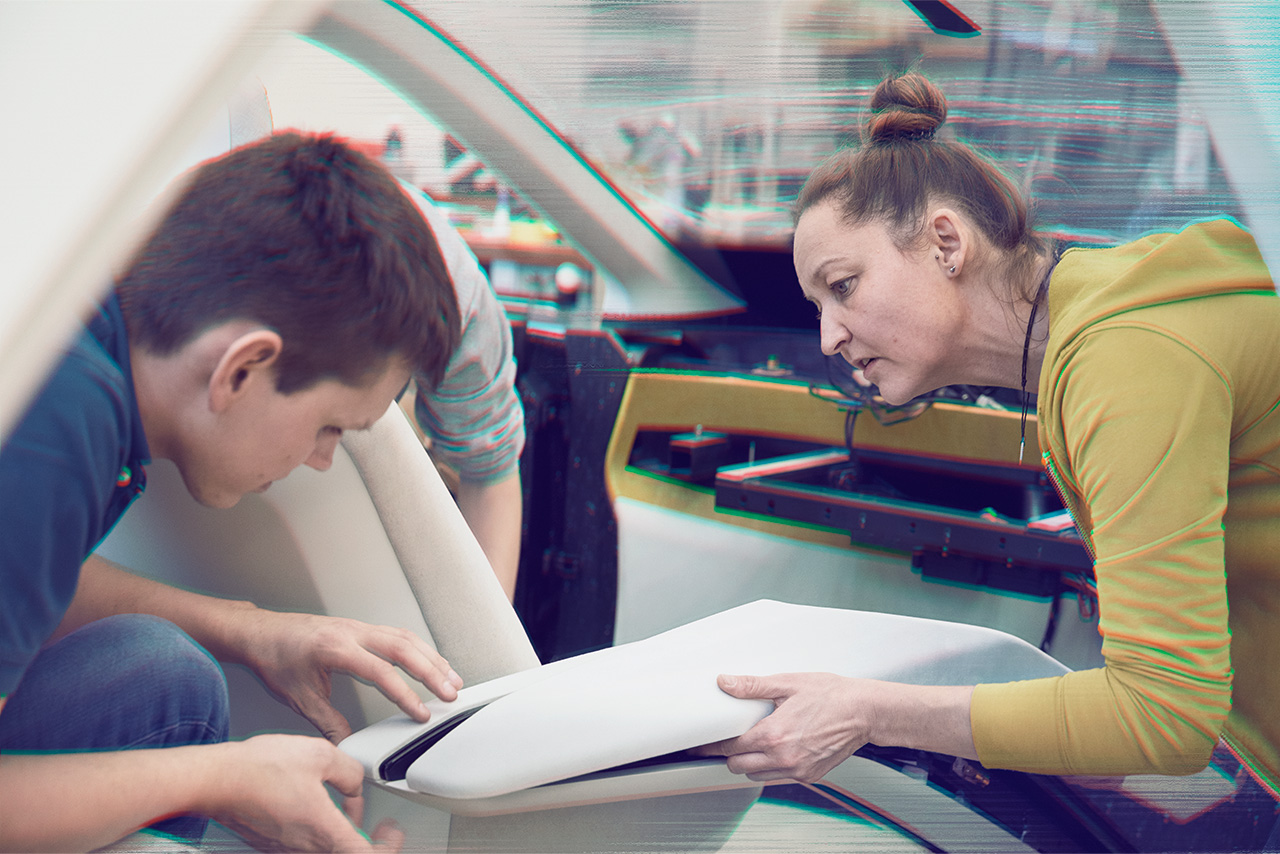 Two BMW Designworks employees working together on the interior of a Neue Klasse vehicle.