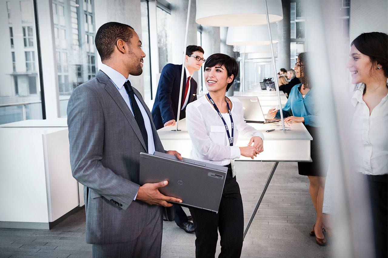 BMW Financial Service employees having a conversation in their office