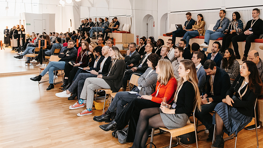 People listen to a lecture.