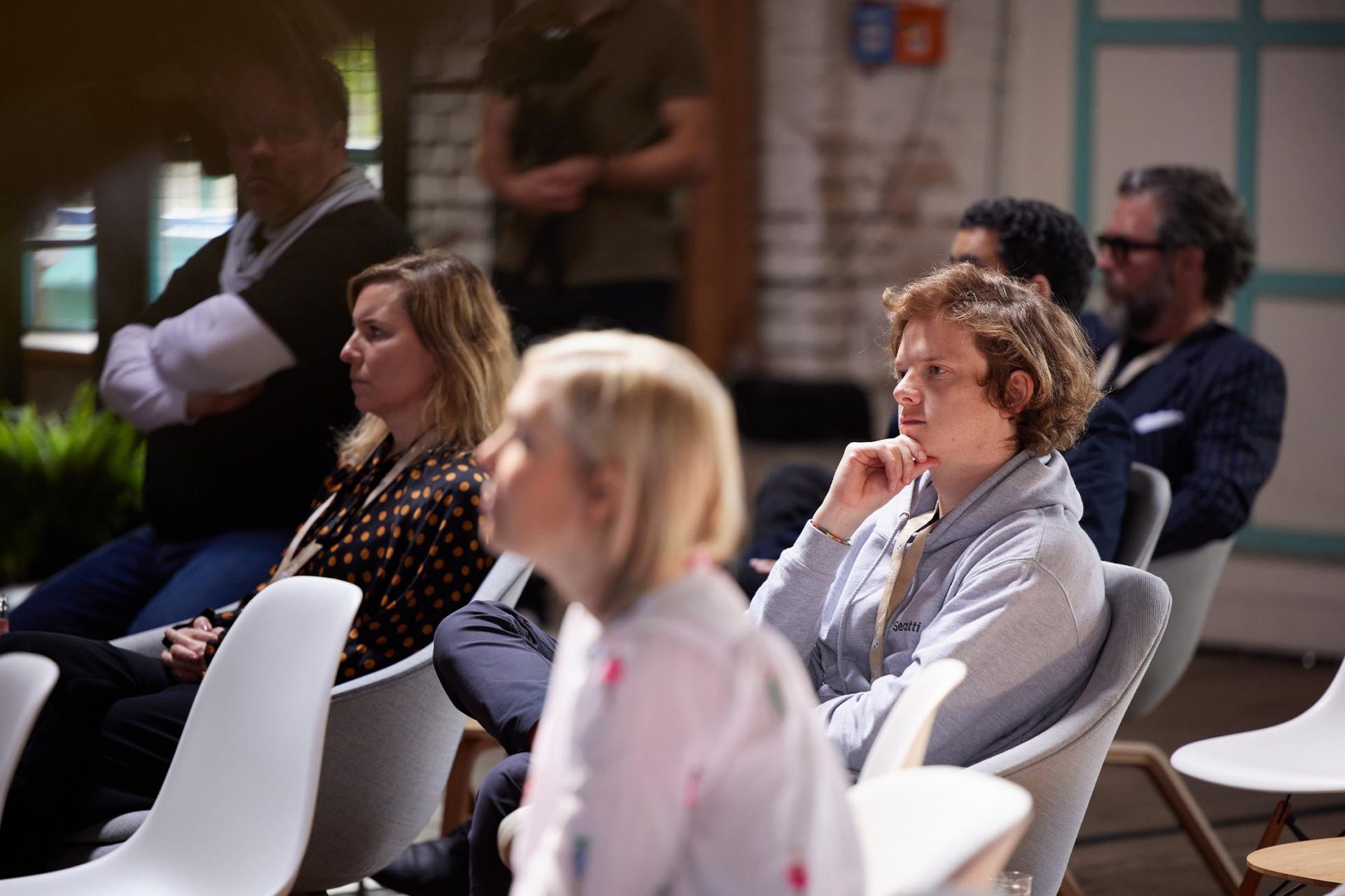   An engaged audience in a modern event space.