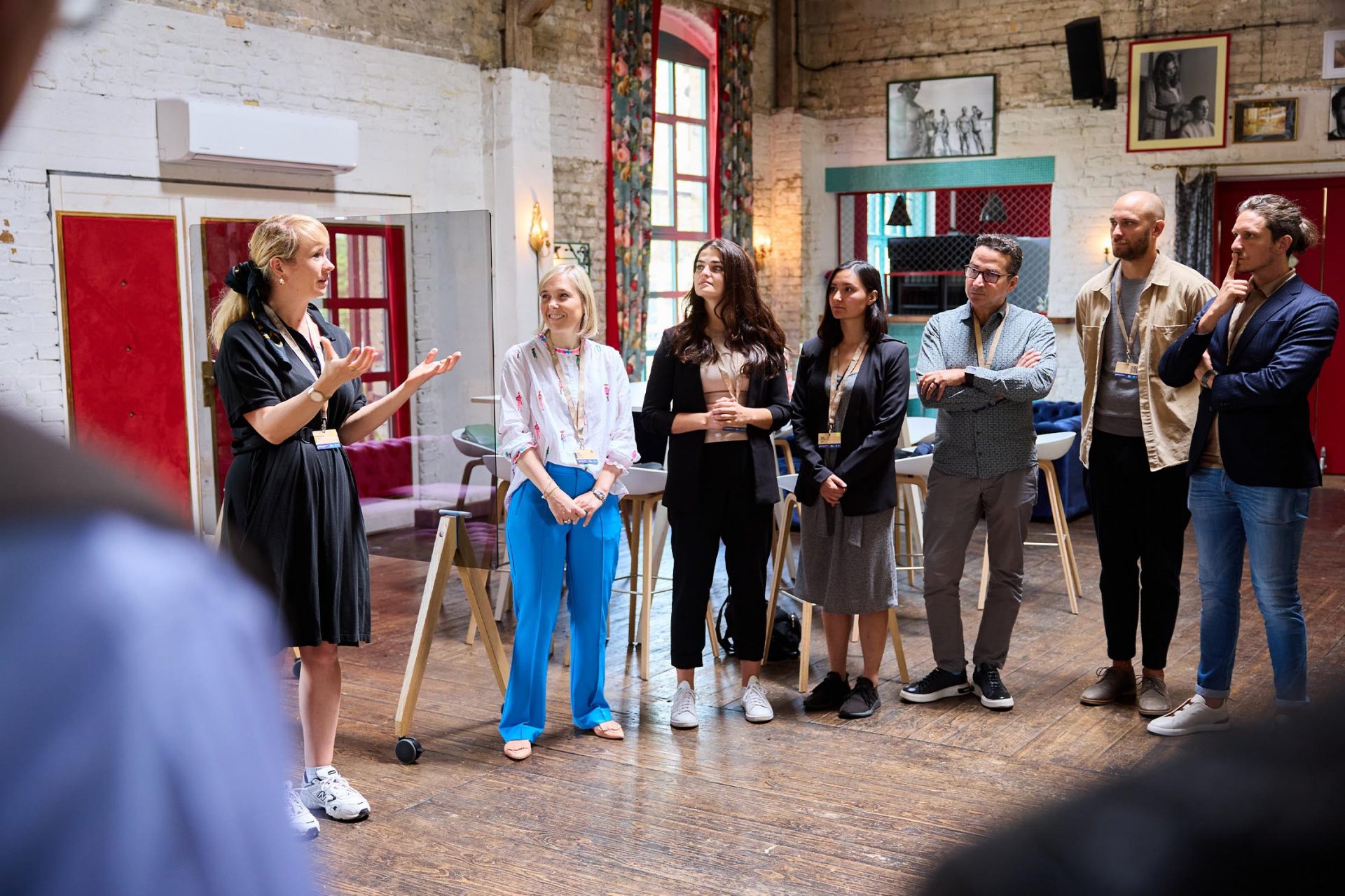   A team giving a presentation in a creative space.