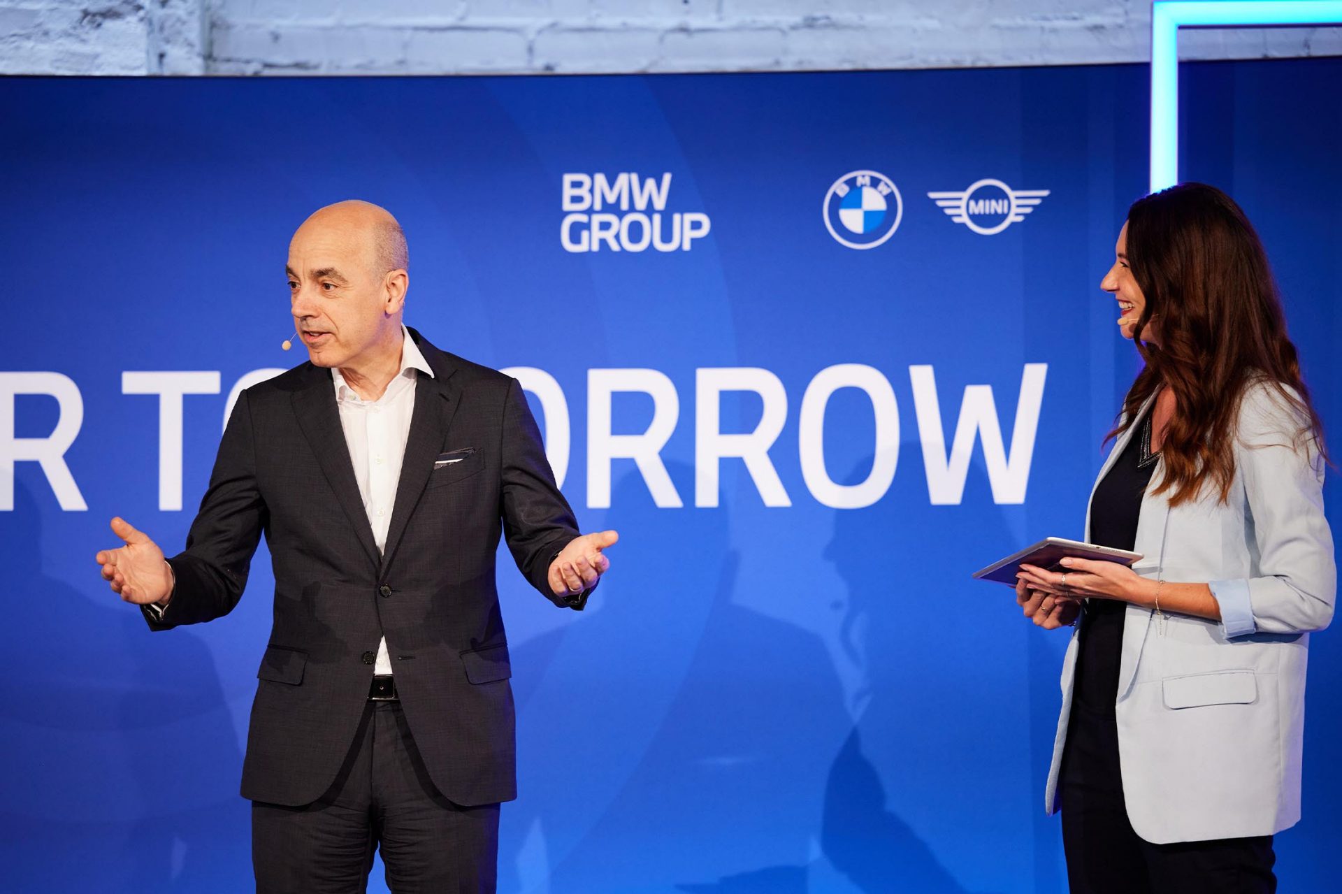  Two people presenting on a stage