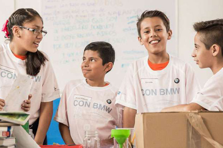 Four children with BMW t-shirts