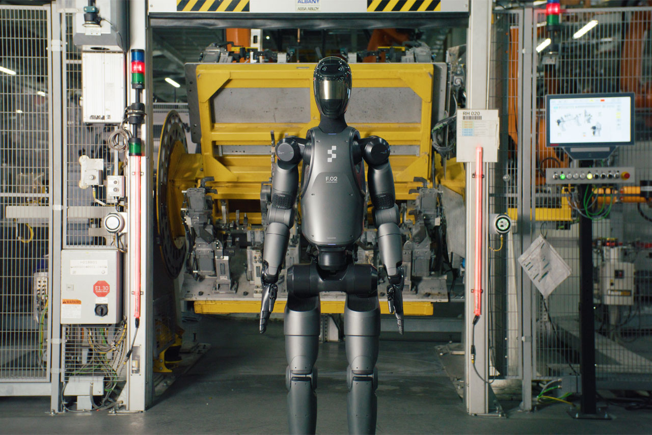 A robot positions itself in front of a machine, ready to interact.