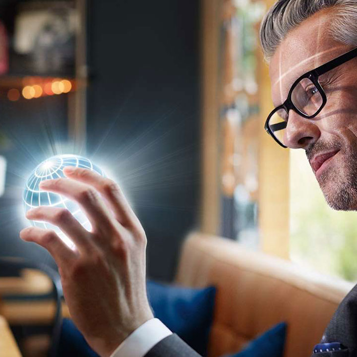 Man holding a globe in his hands.