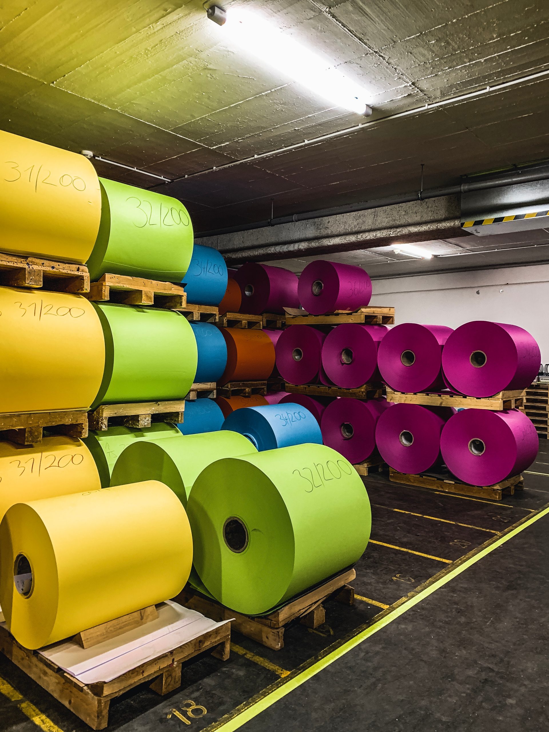 Colourful rolls on pallets