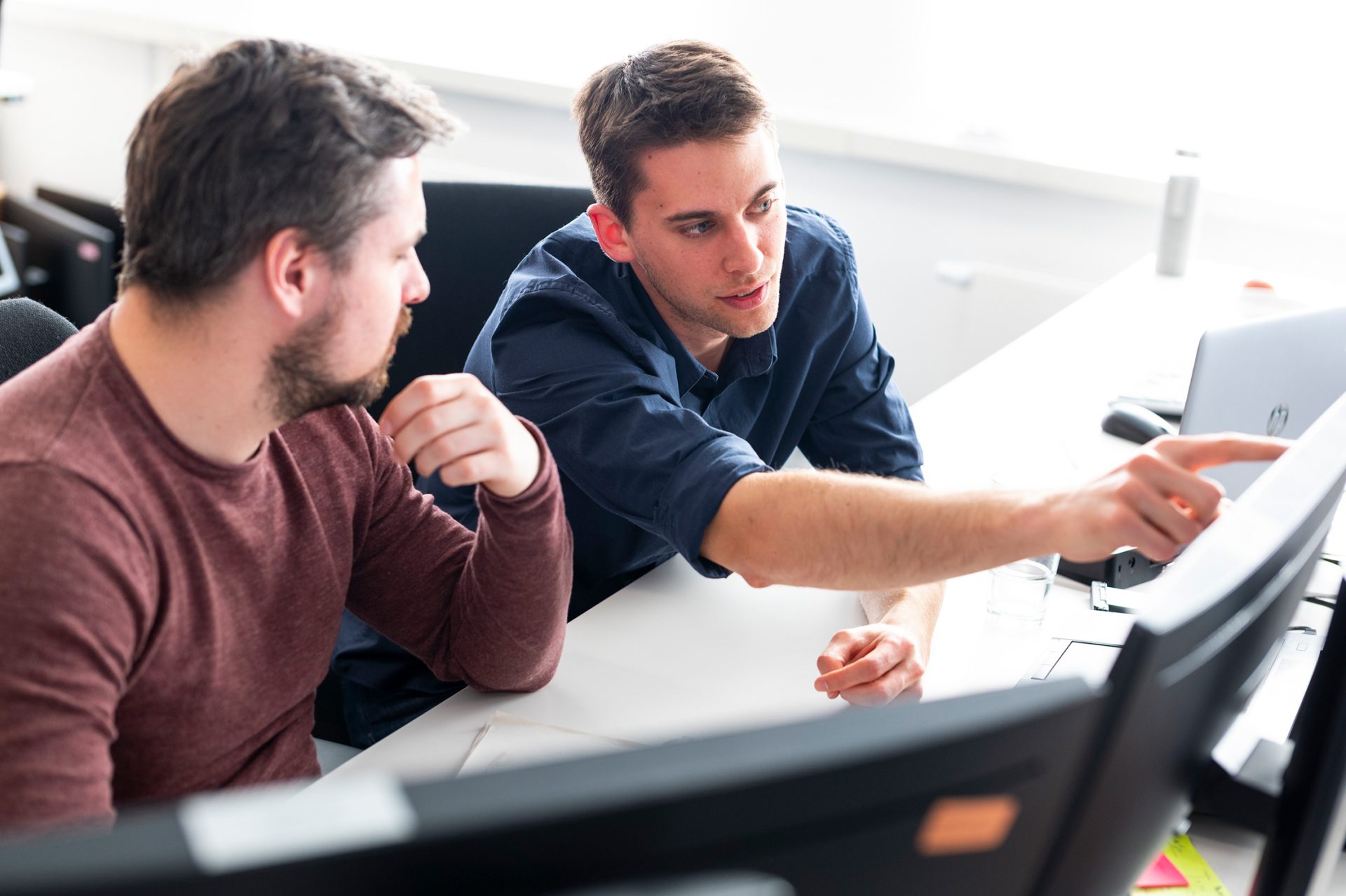 Two men working in an office
