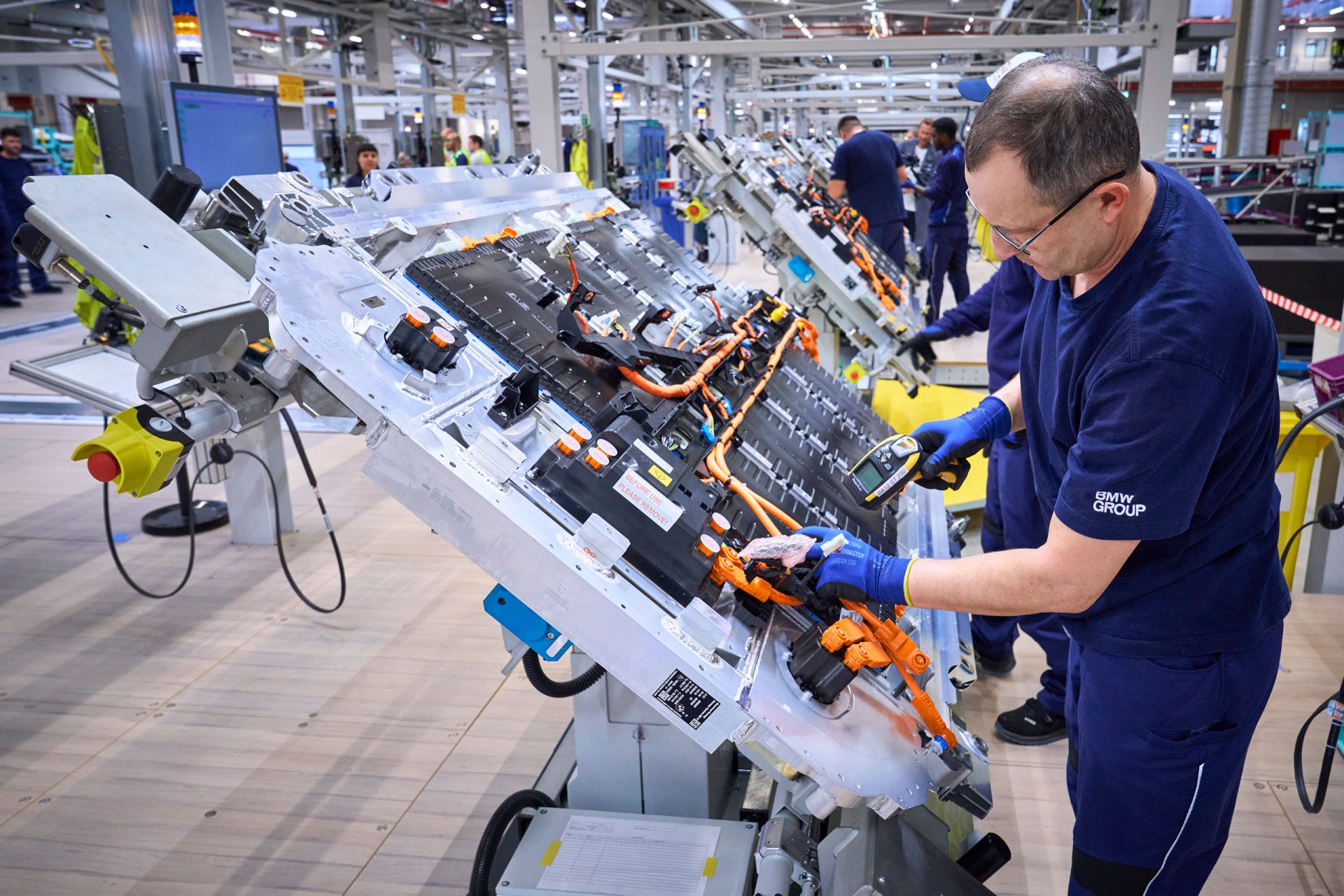 High-voltage battery production at the BMW Group plant in Leipzig: technician checks the components of a battery unit.