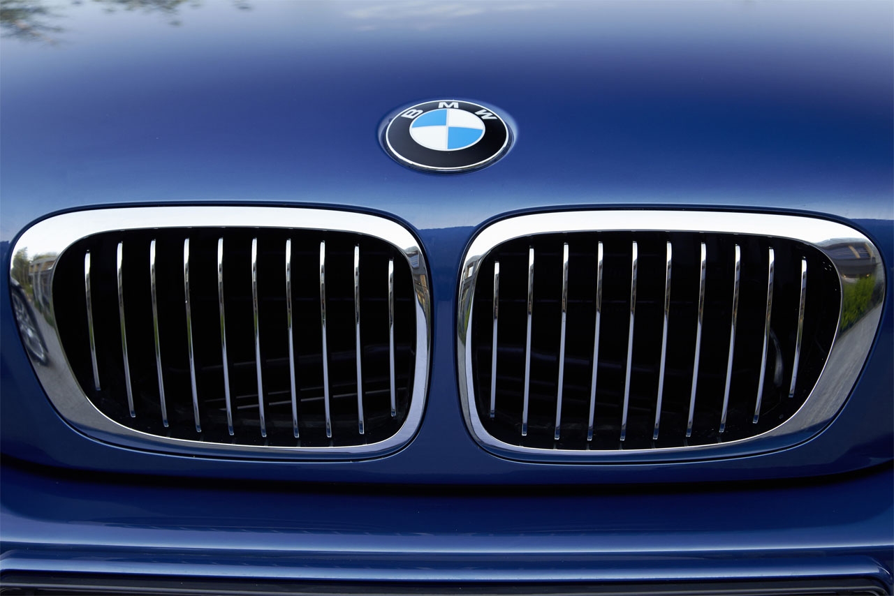 Iconic design feature: A closeup of the BMW kidney grille integrated into the bonnet of an E46 – a 328Ci – in blue.