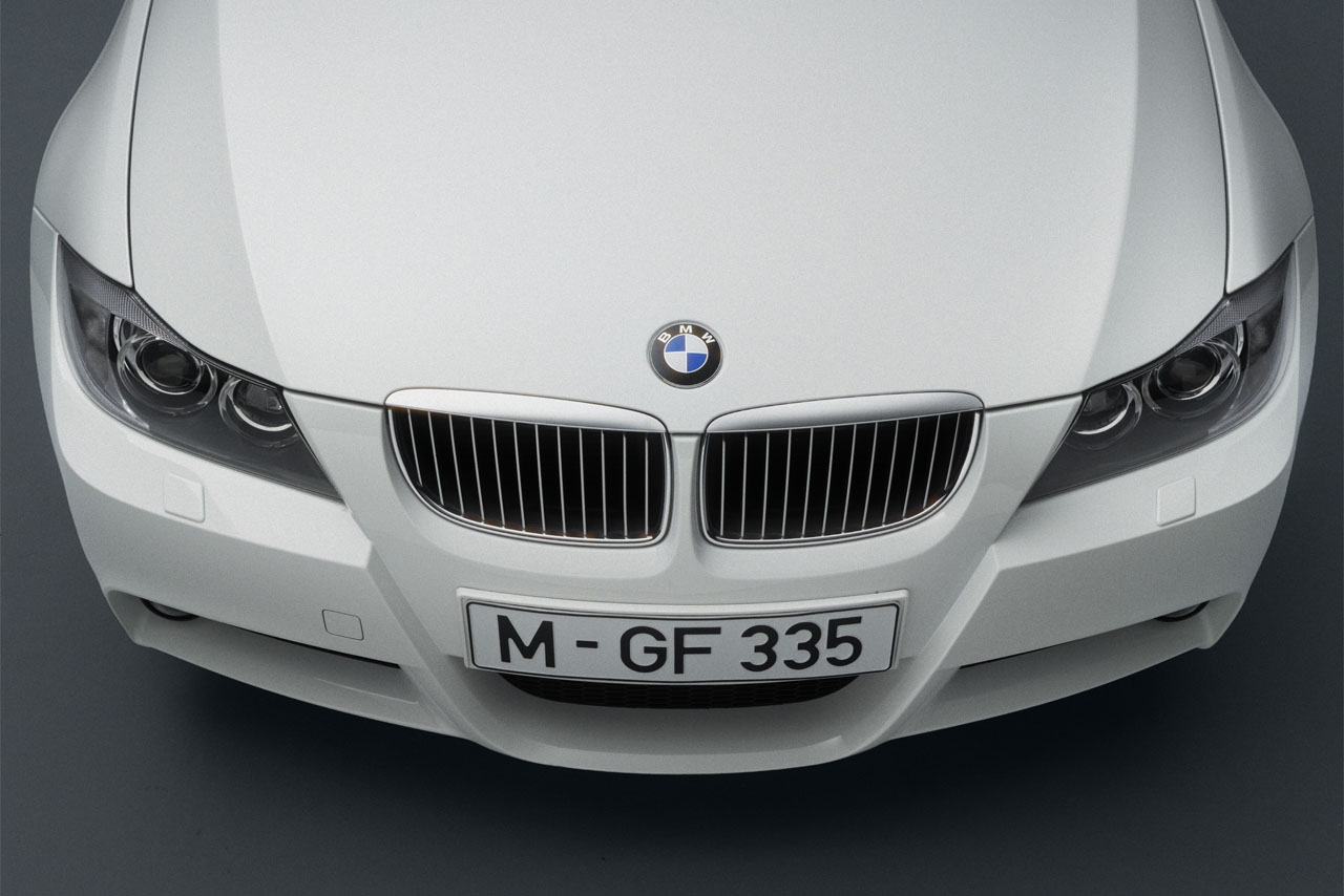 The striking front and bonnet of a white E91 Touring viewed from above.