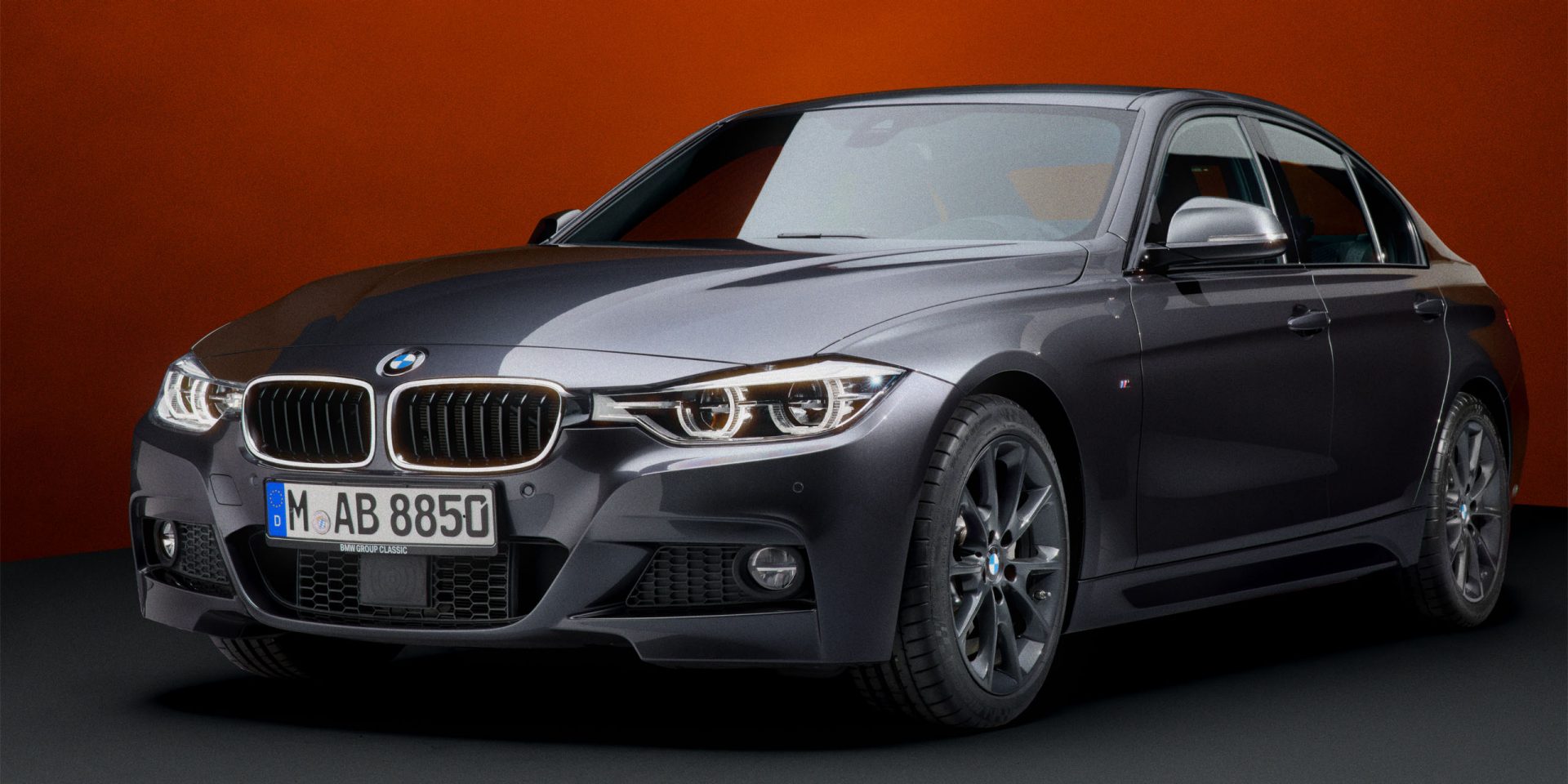 A BMW F30 Sedan in black is seen from the front left, revealing the crisp lines of its front and side.
