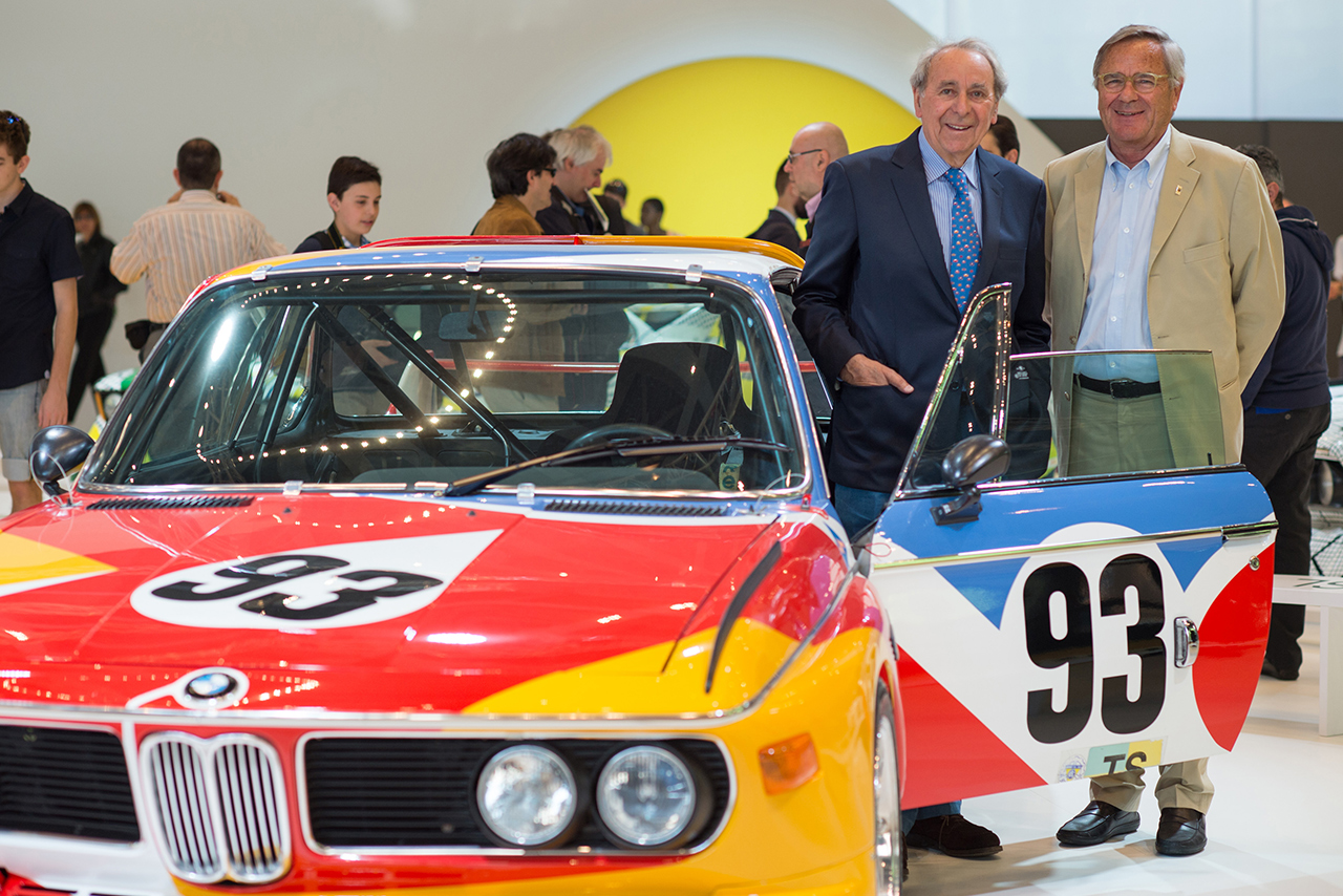 Hervé Poulain and Jochen Neerpasch beside the BMW Art Car by Alexander Calder.