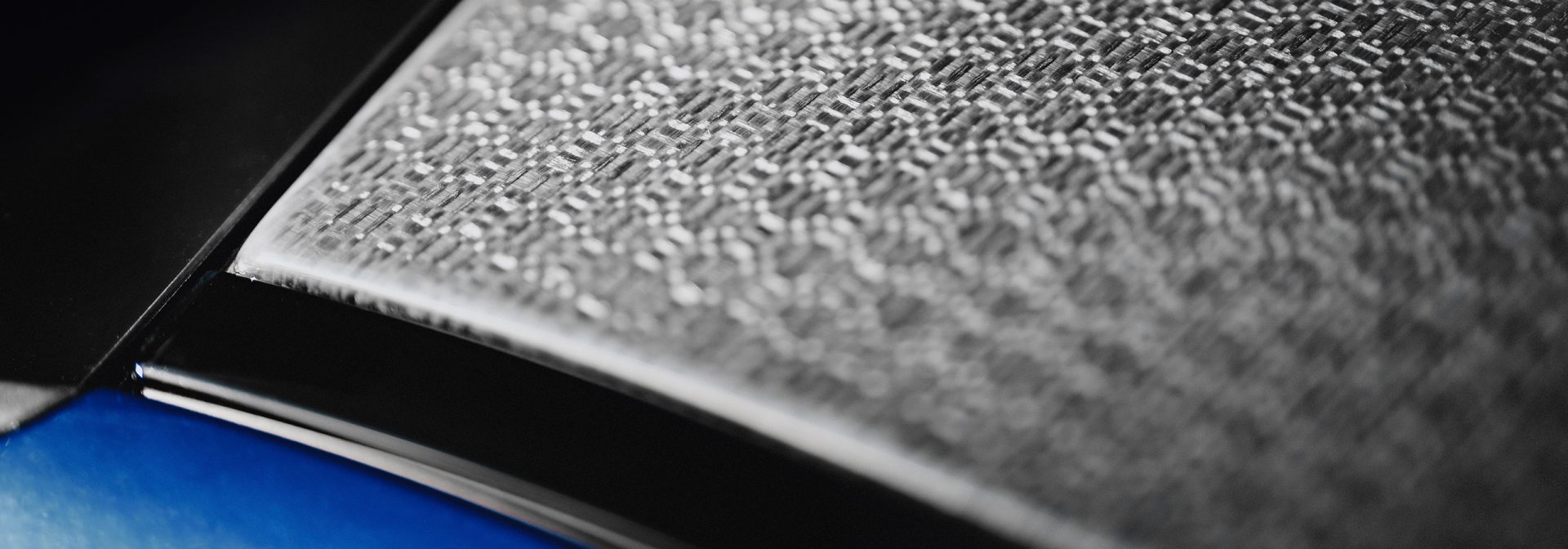 Close-up of a natural-fibre composite roof on a BMW Group car.
