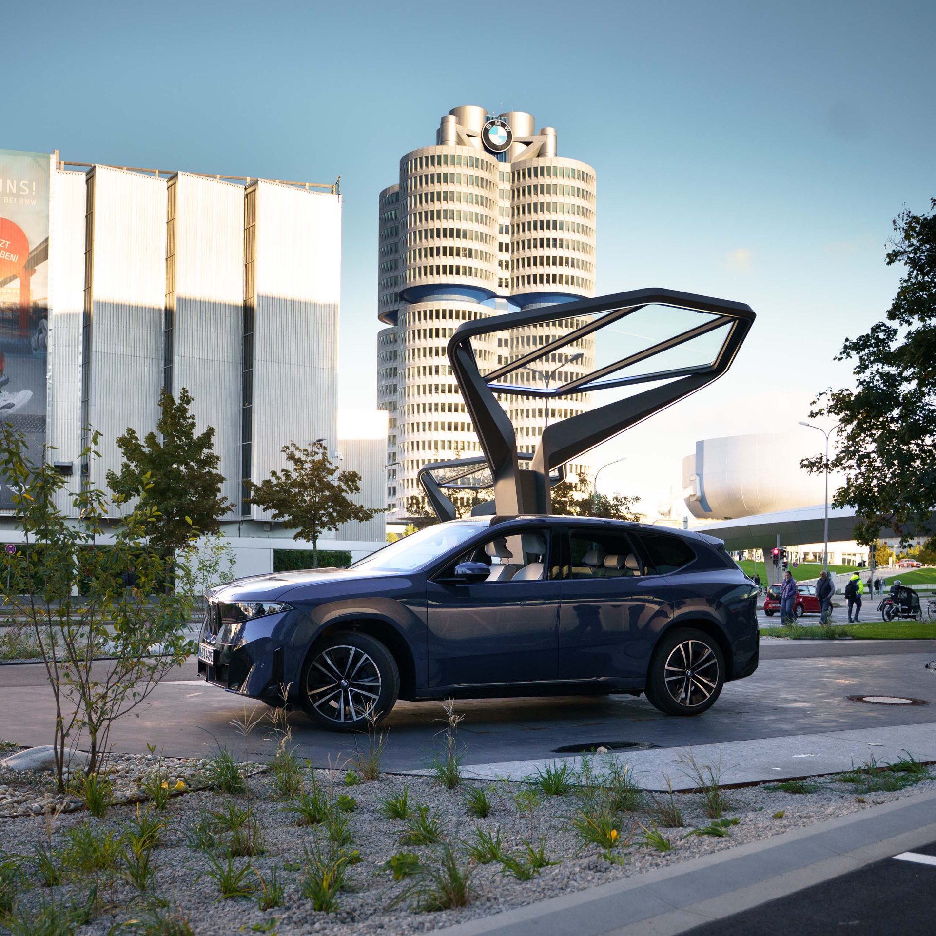 A BMW iX3 in front of BMW’s headquarters in Munich.