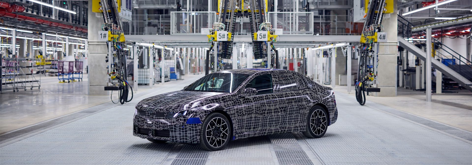 A camouflaged pre-series, fully electric BMW i3 with new production equipment at BMW Group Plant Munich.