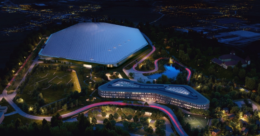 View of modern buildings at night with atmospheric lights.