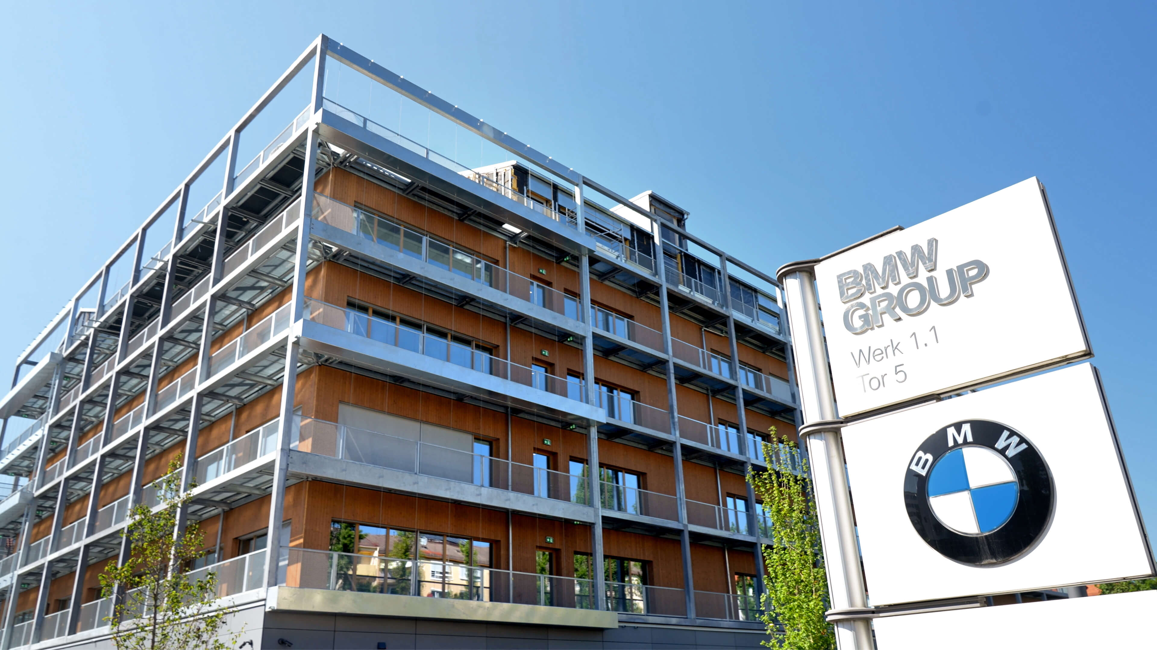 BMW Group talent campus with modern steel‑and‑wood design and site signage.