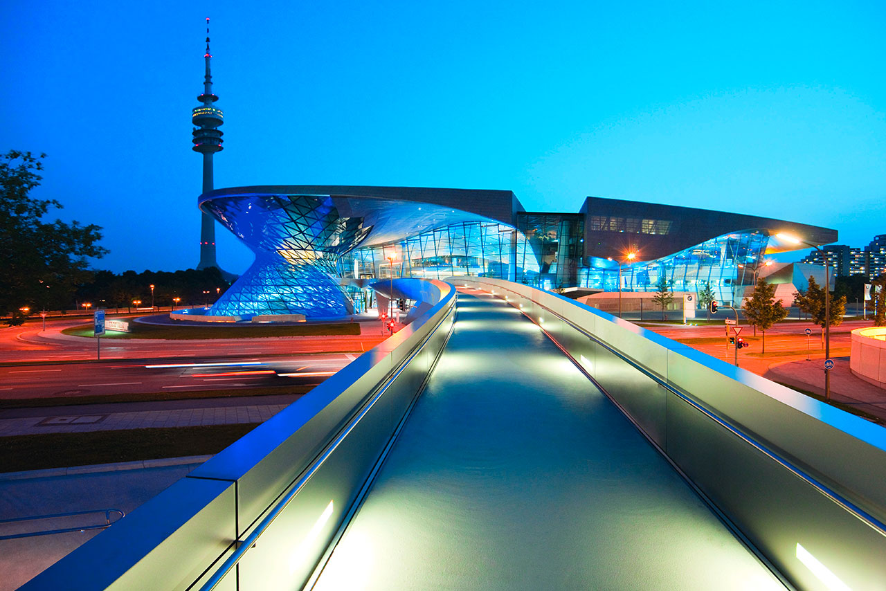 Exterior vie wof the BMW Welt during the blue hour with the Olympic tower in the background
