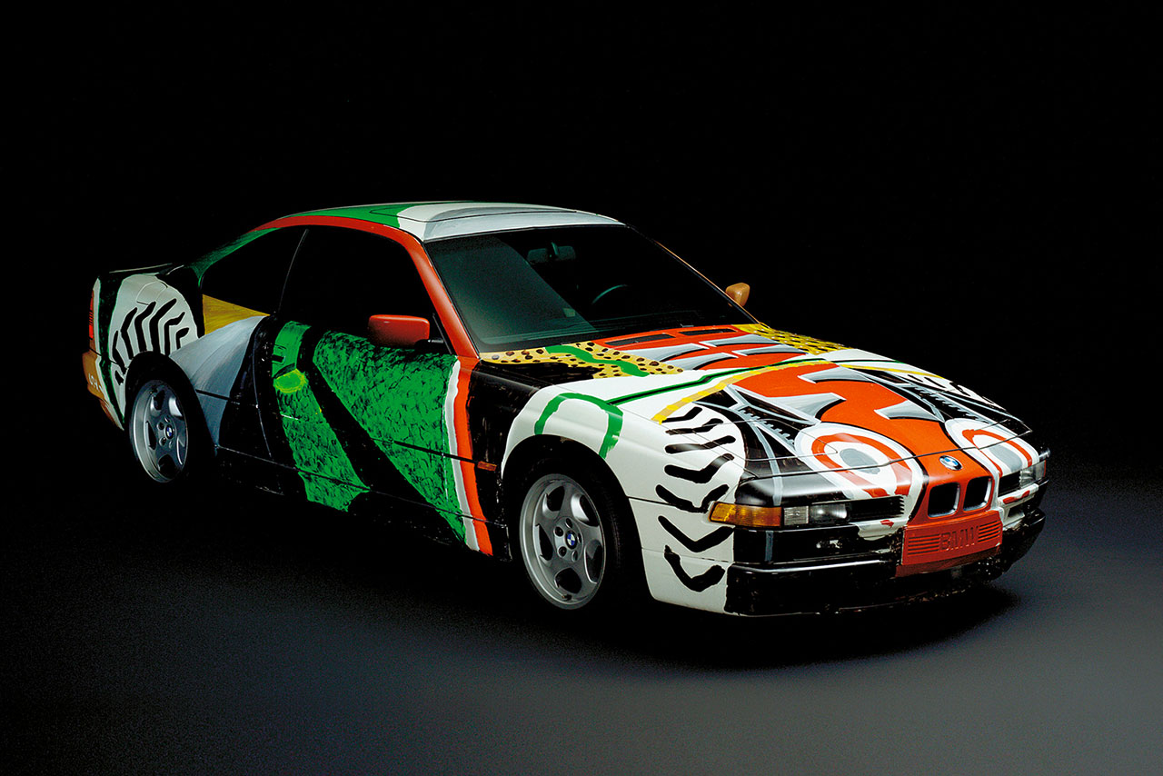 A BMW car with vibrant artistic paint design showcasing abstract patterns.