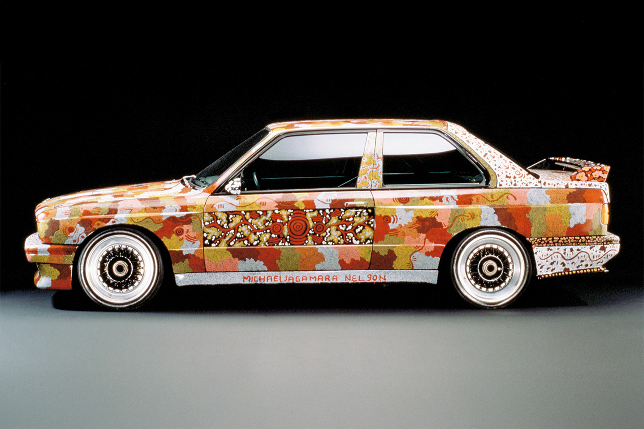 A colorful BMW M3 Group A adorned with artistic patterns and designs.