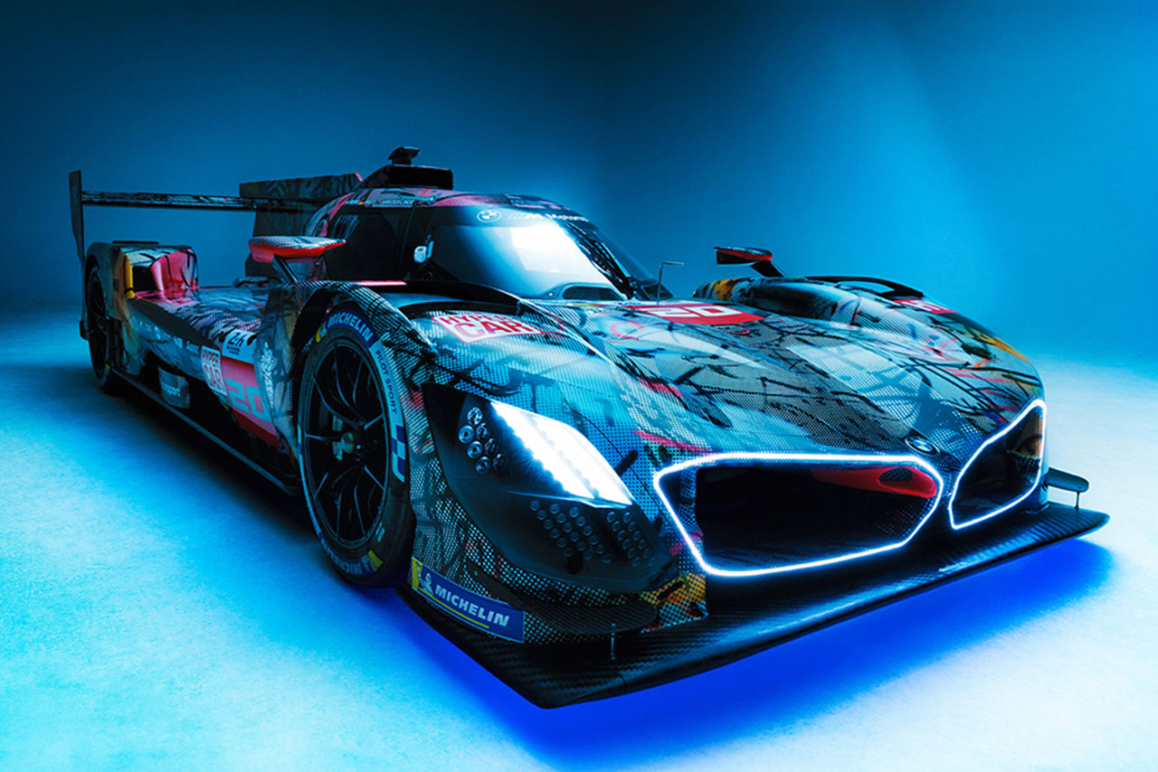 Close-up of an artistic race car featuring bold graphics and a sleek body.