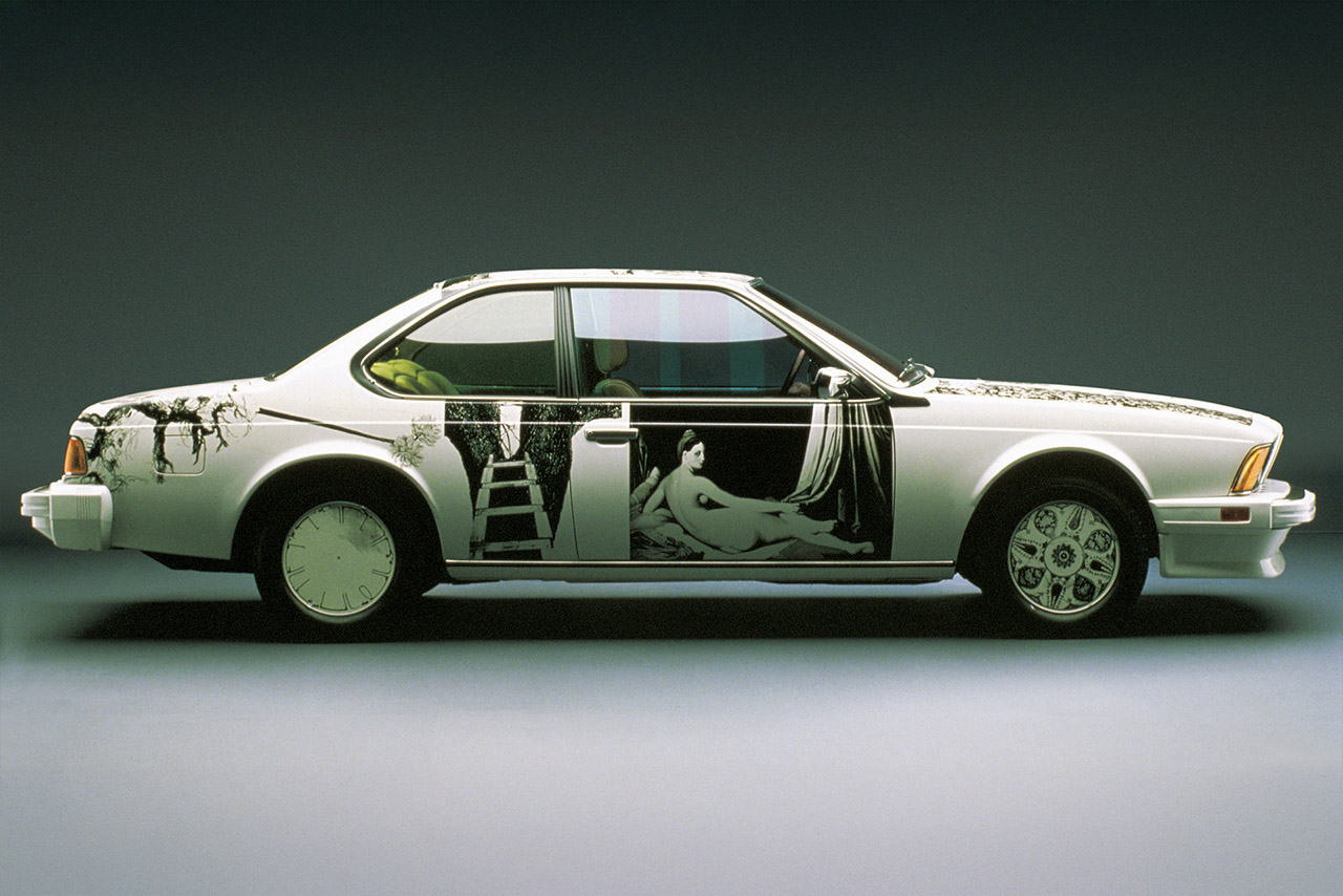 A side view of a 635 CSi featuring artistic black and white designs.